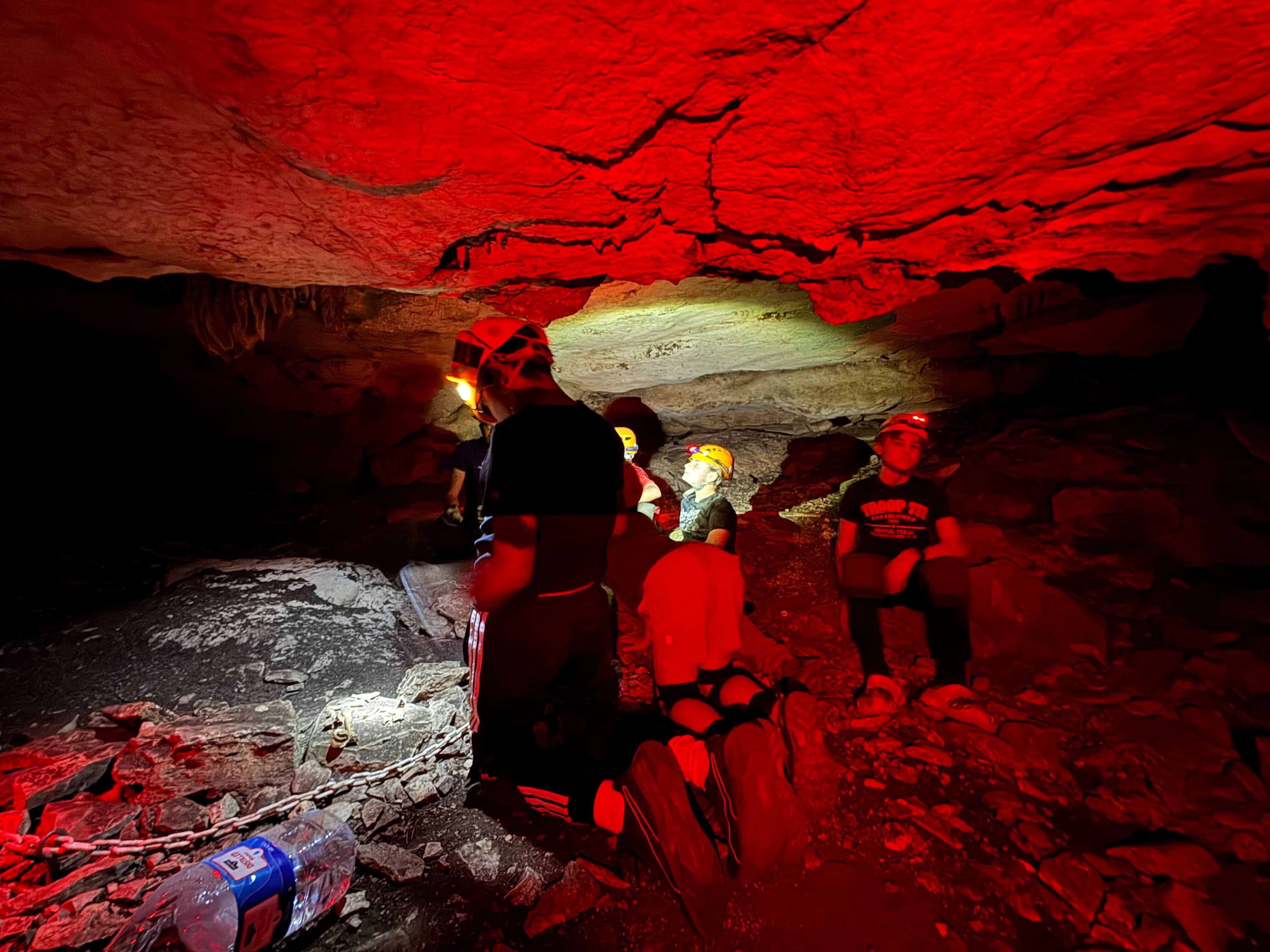 Scouts in a cave during a troop activity