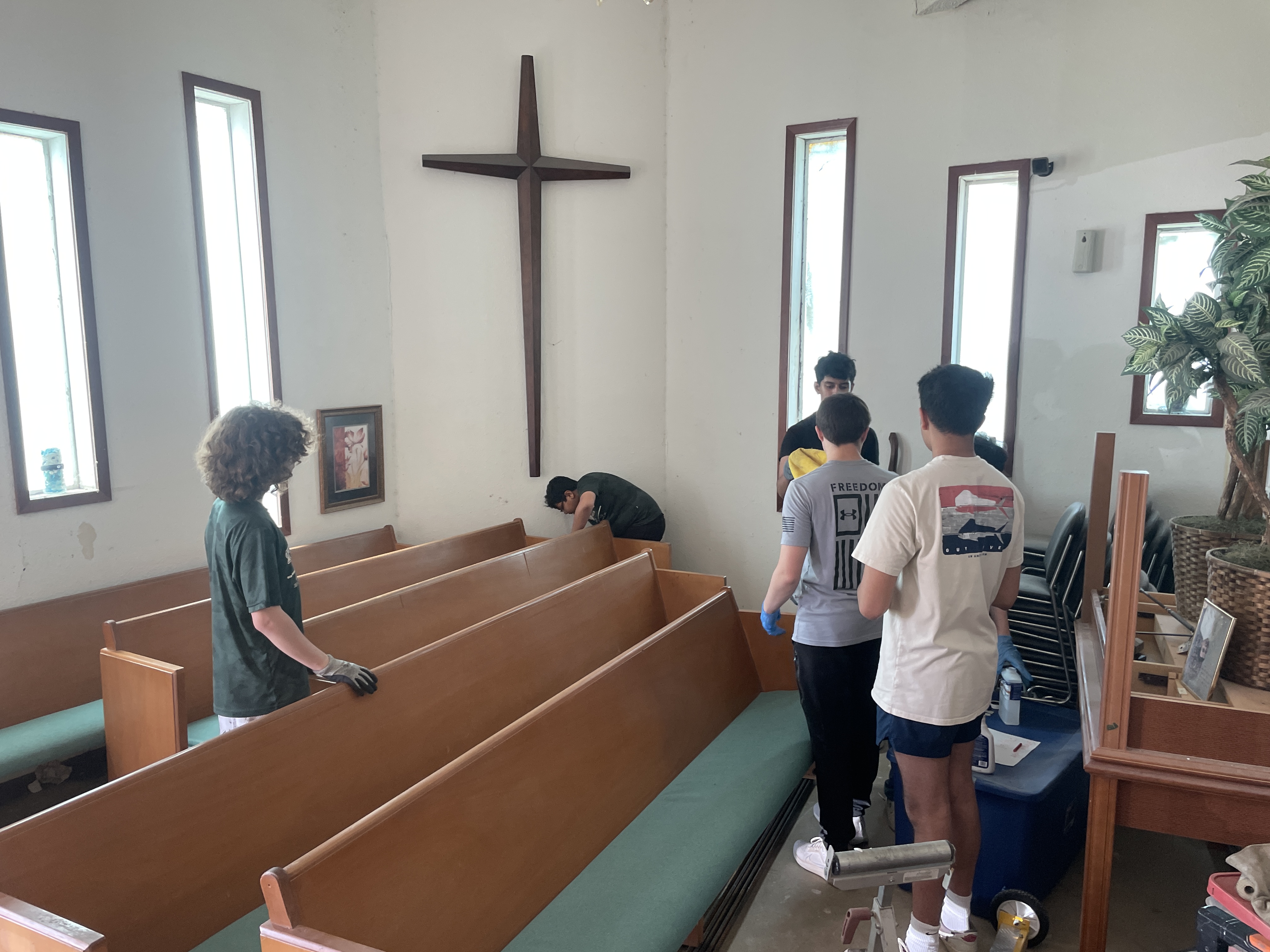 Scouts serving together during a troop service project